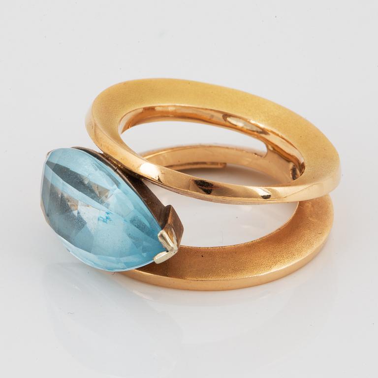 18K gold and navette shaped blue topaz.