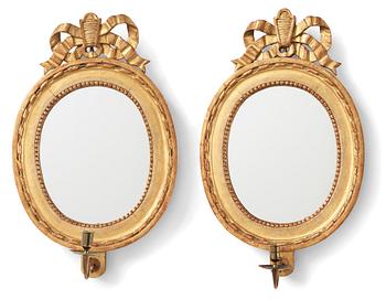 A pair of Gustavian one-light girandole mirrors, late 18th century.
