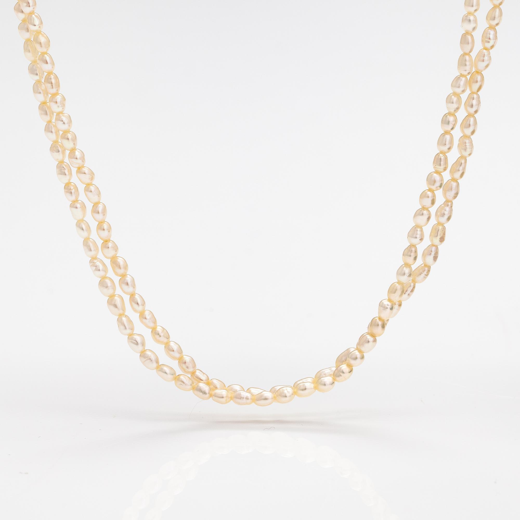 A two-strand pearl collier with cultured pearls and 14K gold clasp.