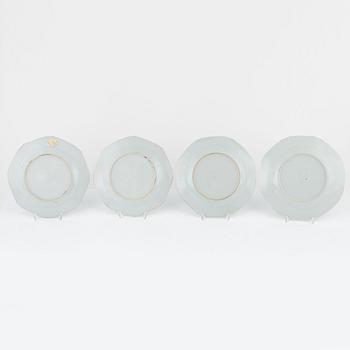 A group of seven Chinese porcelain plates and a charger, 18th / 19th Century.