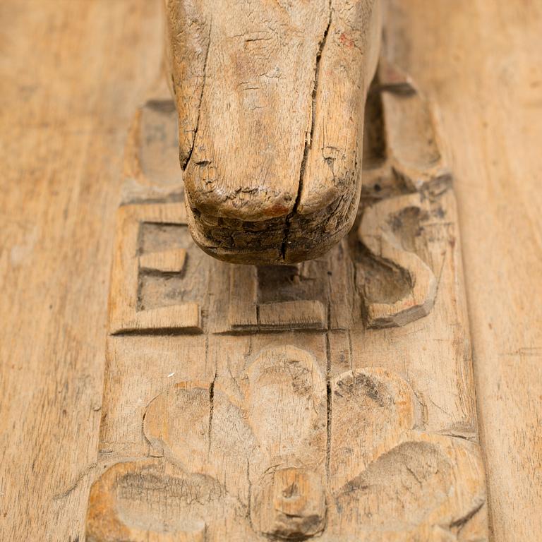 A Swedish folk art mangle board with carved decorationd, owners' initials and the date 1744.