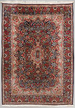 A Kirman rug, old, ca 272 x 193 cm.