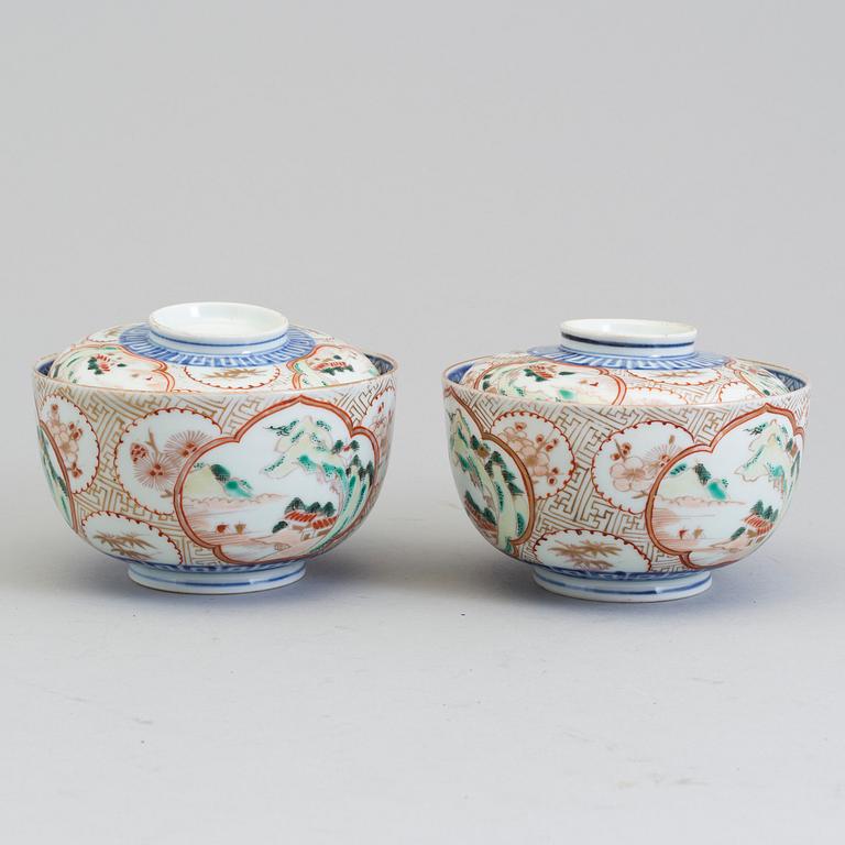 A pair of Japanese early 20th century porcelain bowls with covers.