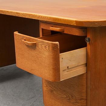 A 1950/60's oak writing desk.