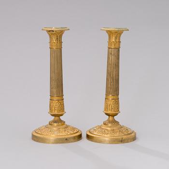 A PAIR OF FRENCH ORMOLU CANDLESTICKS, 19th century.