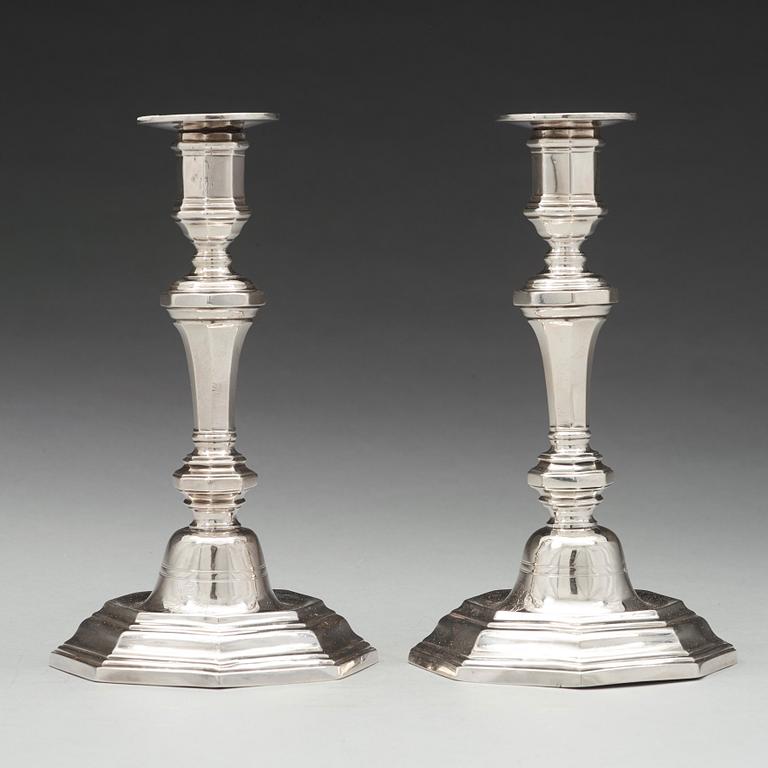 A pair of French 18th century silver candlesticks, unidentified makers mark.