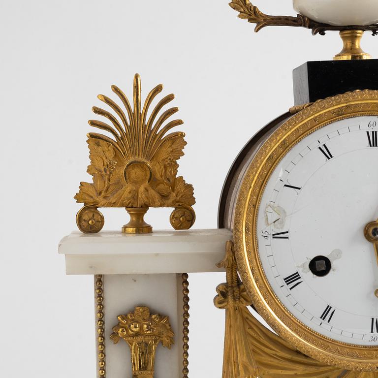 A French Louis XVI ormolu and marble portico clock, late 18th century.