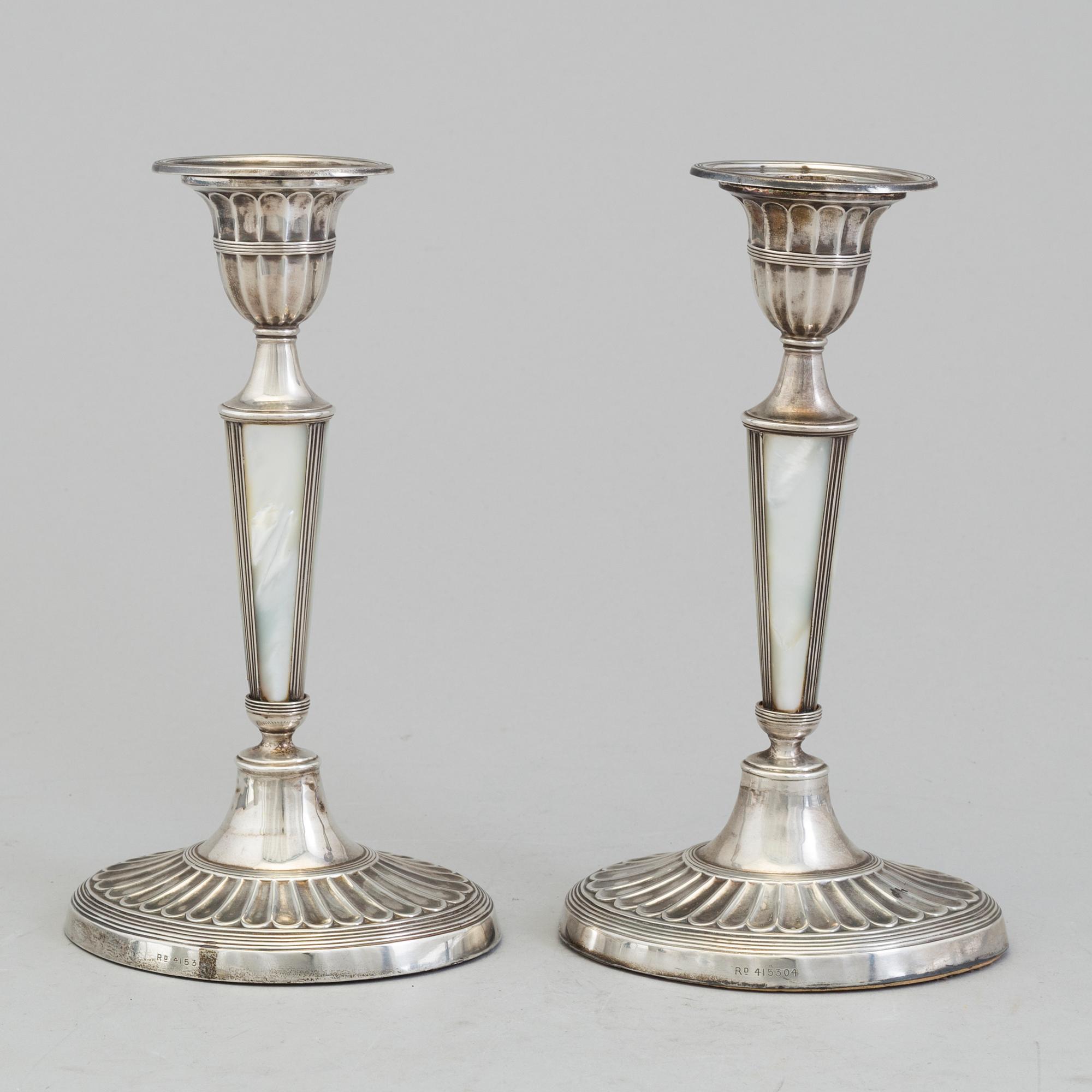 HARRISON BROTHERS & HOWSON, a pair of silver and mother of pearl candlesticks from Sheffield, England, 1926.