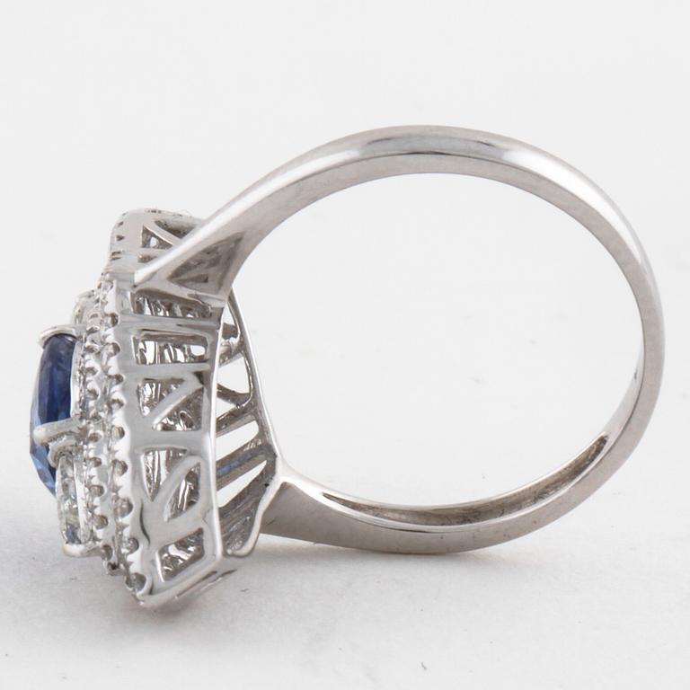 A sapphire and pear- and brilliant cut diamond ring.