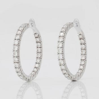 A pair of diamond earrings, 3.85 cts in total,according to engraving.