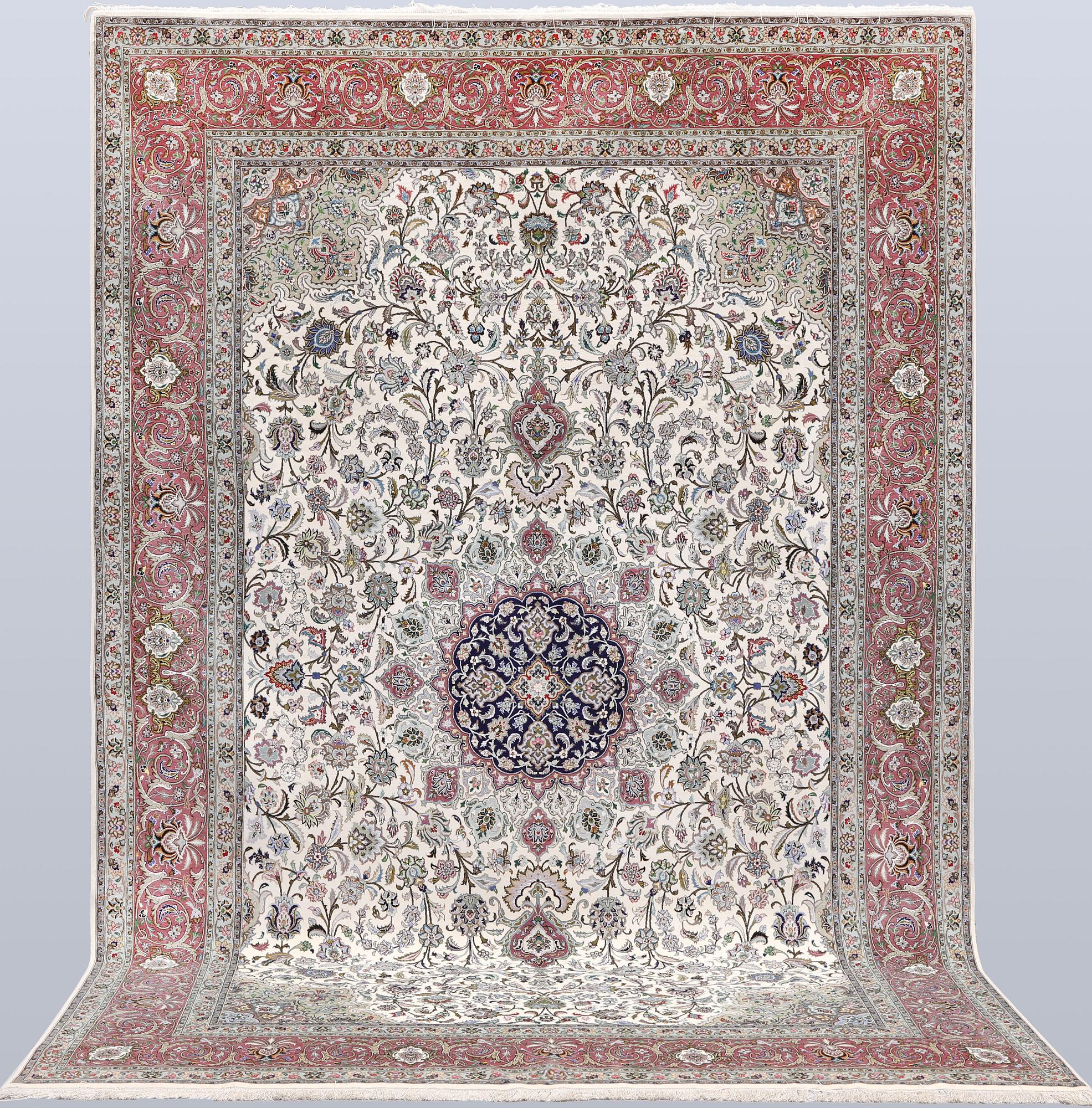A part silk Tabriz carpet, 310 x 205 cm.