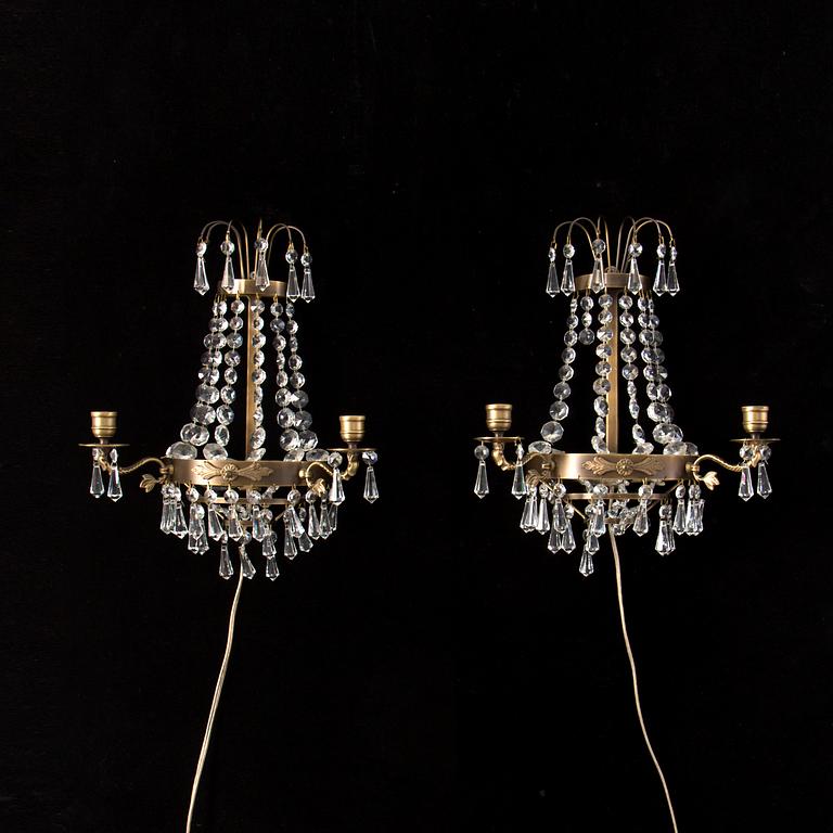A pair of 20th century Gustavian style wall lights for two candles.