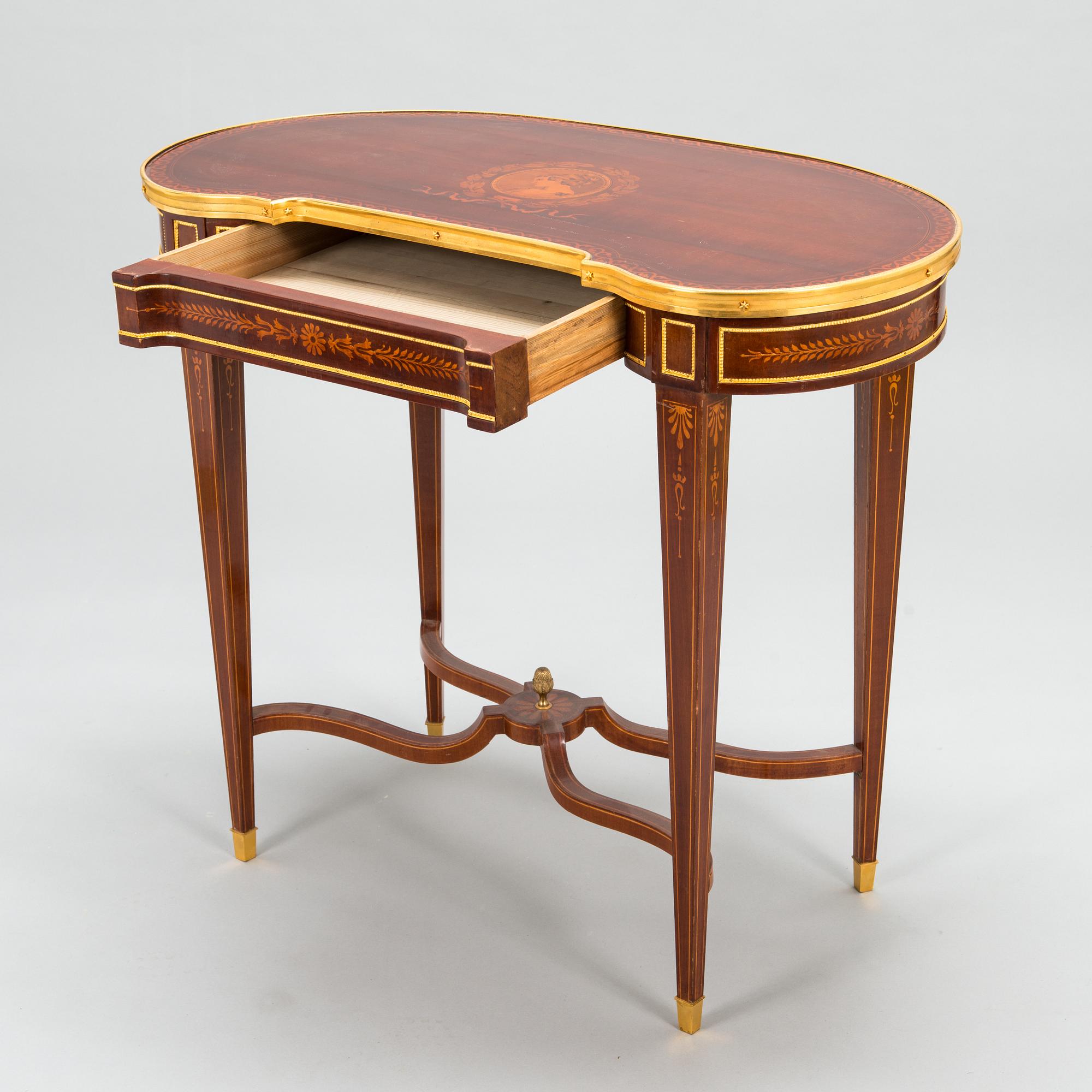 A Directoire style marquetry table from around year 1900.