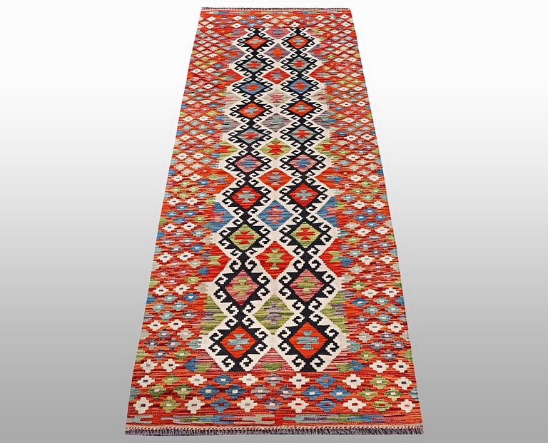 A runner kilim, ca 291 x 84 cm.