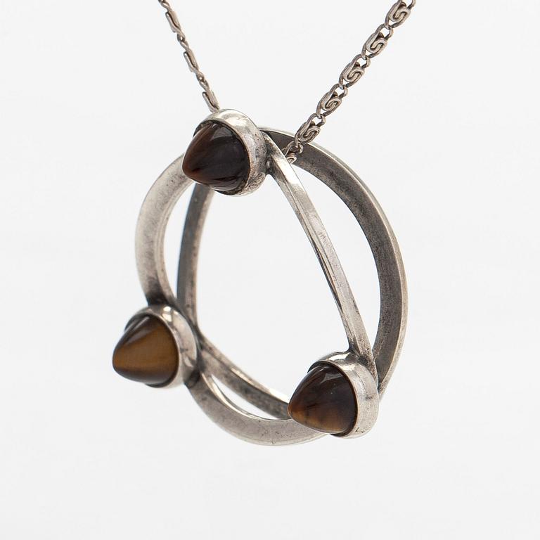 Elis Kauppi, a silver and tiger's eye pendant, Kupittaan Kulta, Turku. With chain in silver.