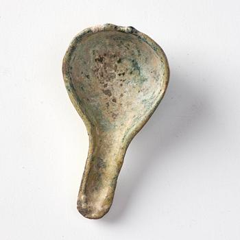 A painted pottery bell and a green glazed spoon, Han dynasty  (202 BC-220 AD).