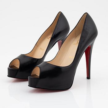 Christian Louboutin, a pair of black leather peep toe pumps, size 37 1/2.