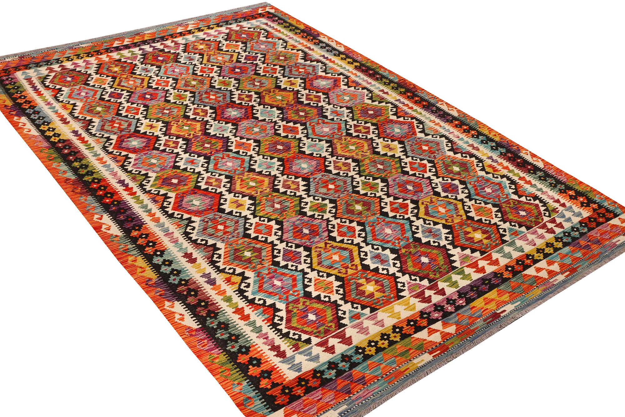 An Afghan Kilim carpet, c. 298 x 202 cm.