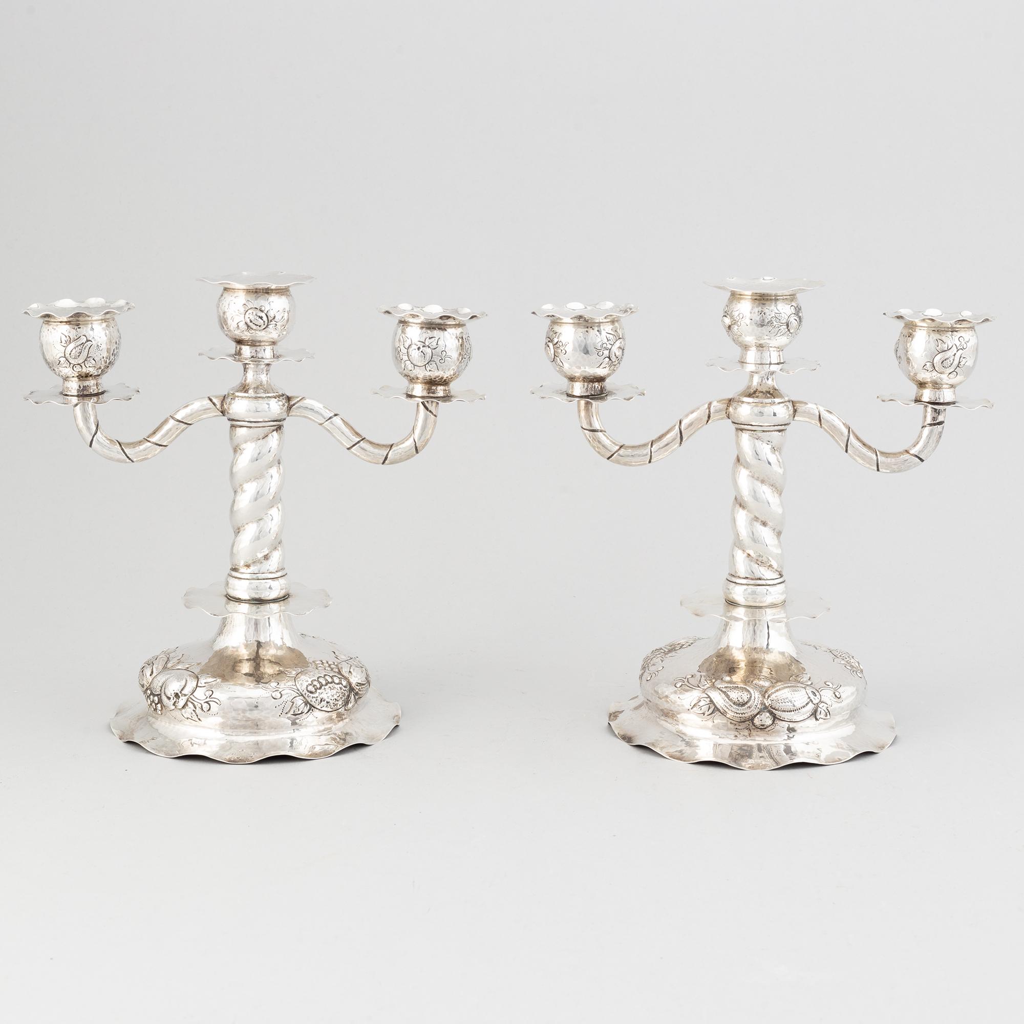 A pair of Swedish baroque-style silver candelabra, mark of CG Hallberg, Stockholm 1926.