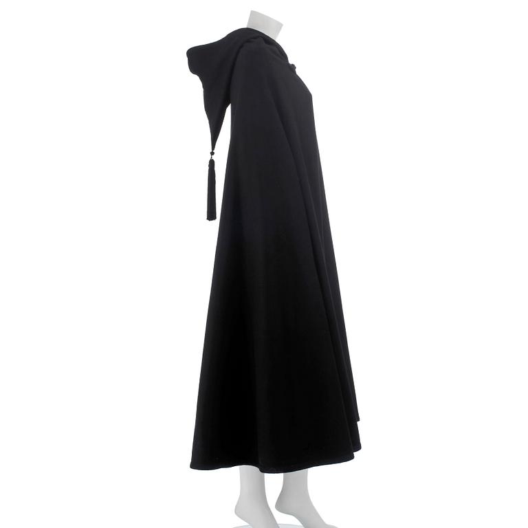 YVES SAINT LAURENT, a black wool cape with hood. .