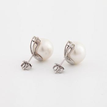 A pair of cultured pearl and old cut diamond earrings.