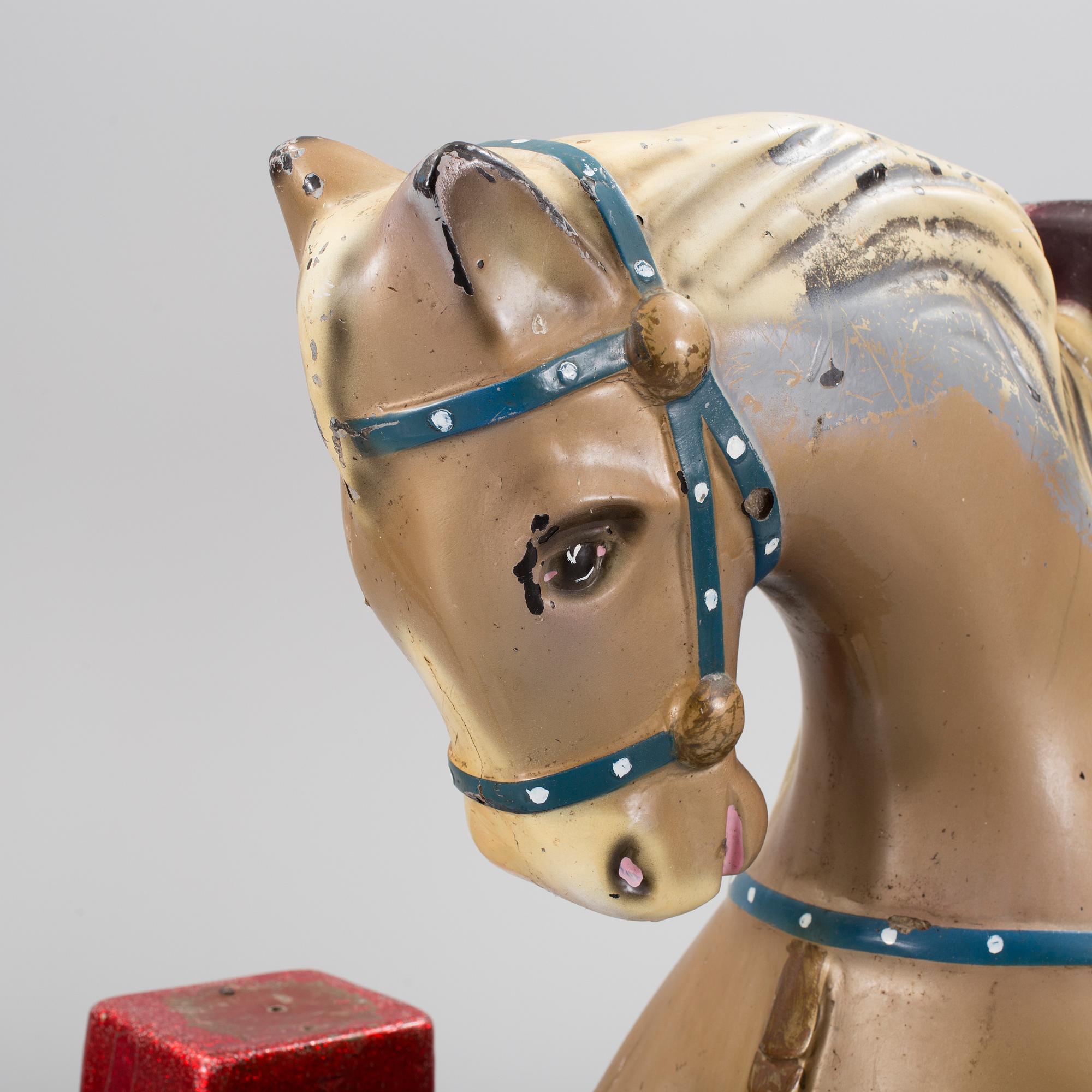A motorized fiberglass horse probably 1970s.