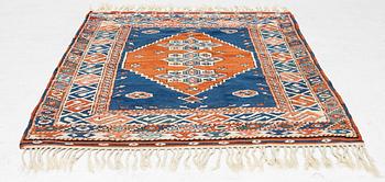 A semi-antique Turkish rug, 175 x 123 cm.