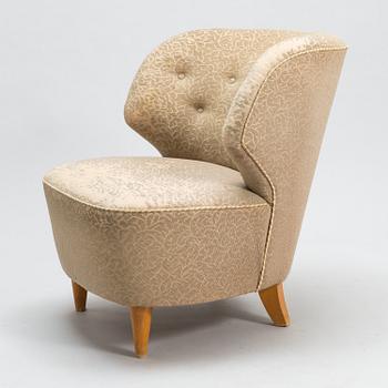 A mid-20th-century armchair.