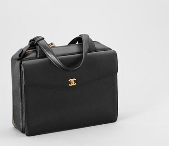 A 21th cent black "caviar" leather beautybox/weekendbag by Chanel.