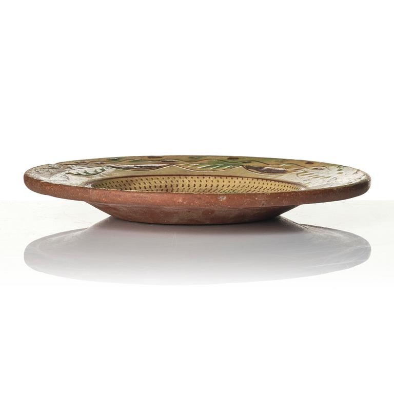 An earthenware dish, dated 1792.