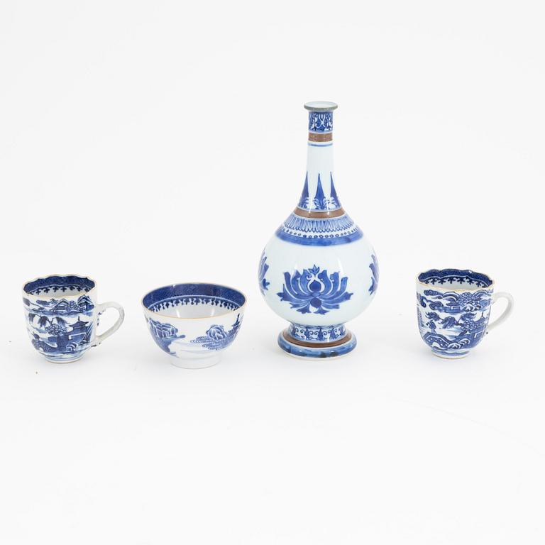 A group of Chinese blue and white porcelain: dish, vase, three cups and two plates. 18th and 20th century.
