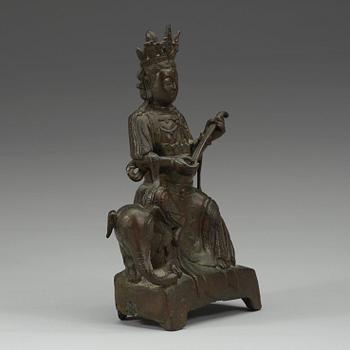 A seated bronze figure of Guanyin on an elephant, Qing dynasty, 19th Century.