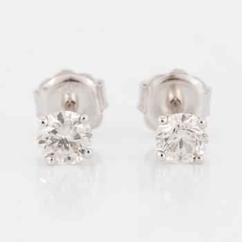 A pair of diamont stud earrings.