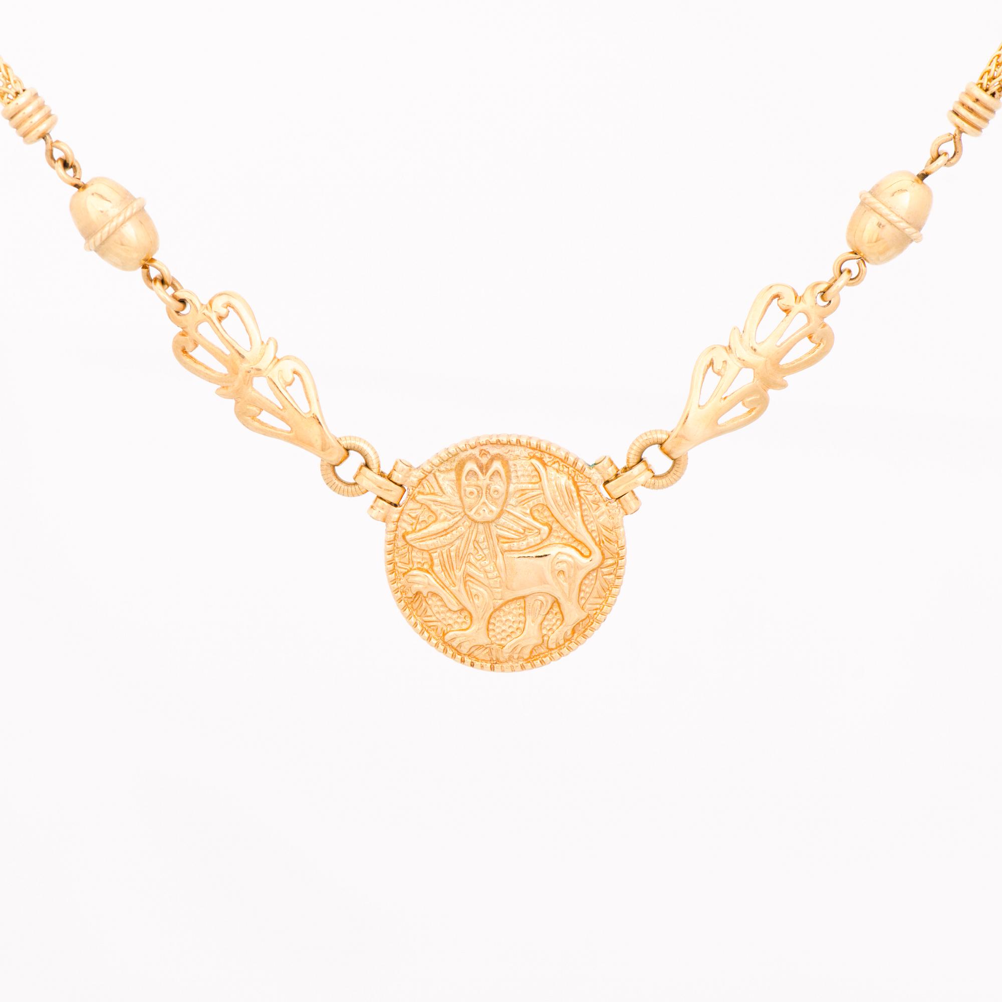 KAULAKORU, "Aurinkoleijona", 18K kultaa. Kalevala Koru 1998.