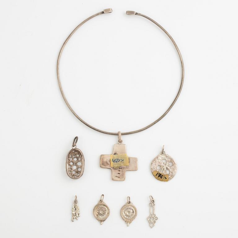 Lars Arby, a neck ring and seven pendants, silver, Gothenburg 1966, 1977 and 1982.
