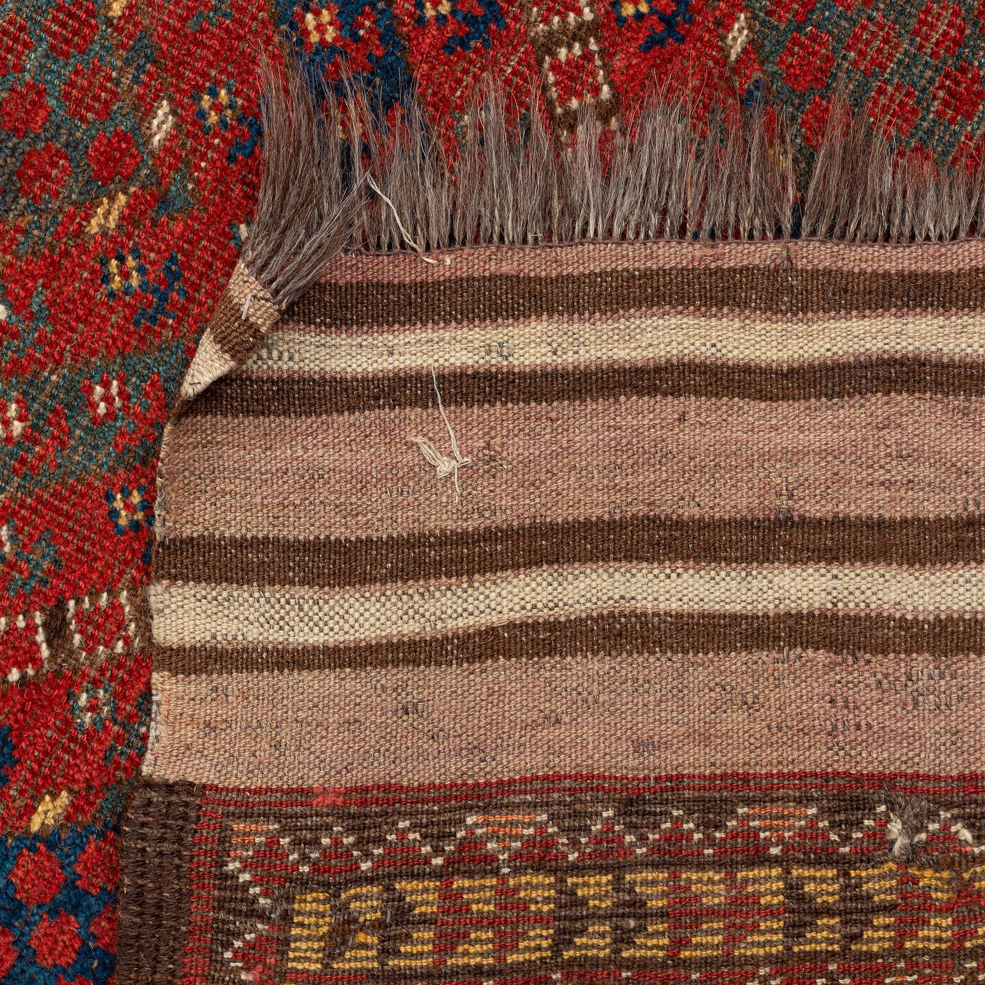An antique Beshir carpet, ca 495 x 206 cm, around the year 1875.