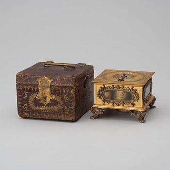 A Baroque 17th century traweller's clock in original case.