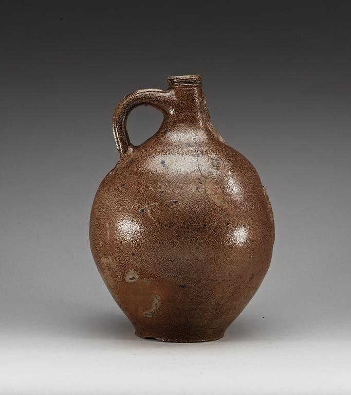 A large salt-glazed stoneware 'Bartman jug', 17th Century.