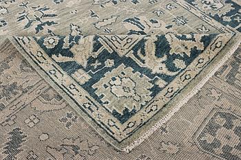 An oriental carpet with Mamluk design, c. 372 x 277 cm.