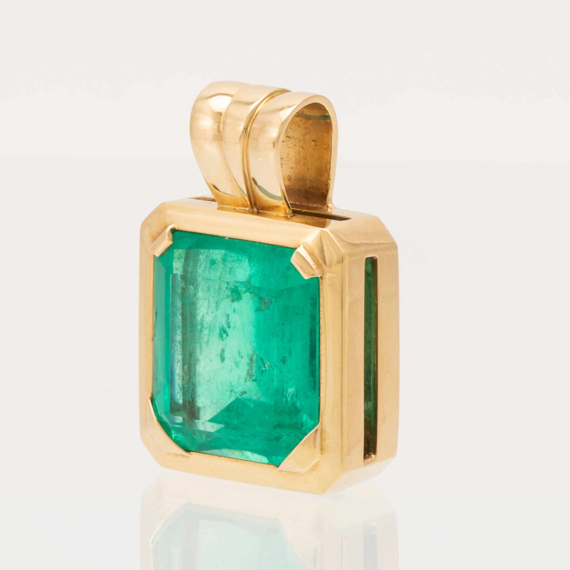 An 18K gold pendant set with an emerald-cut emerald, Schrittesser Gold & Silversmith Gothenburg.