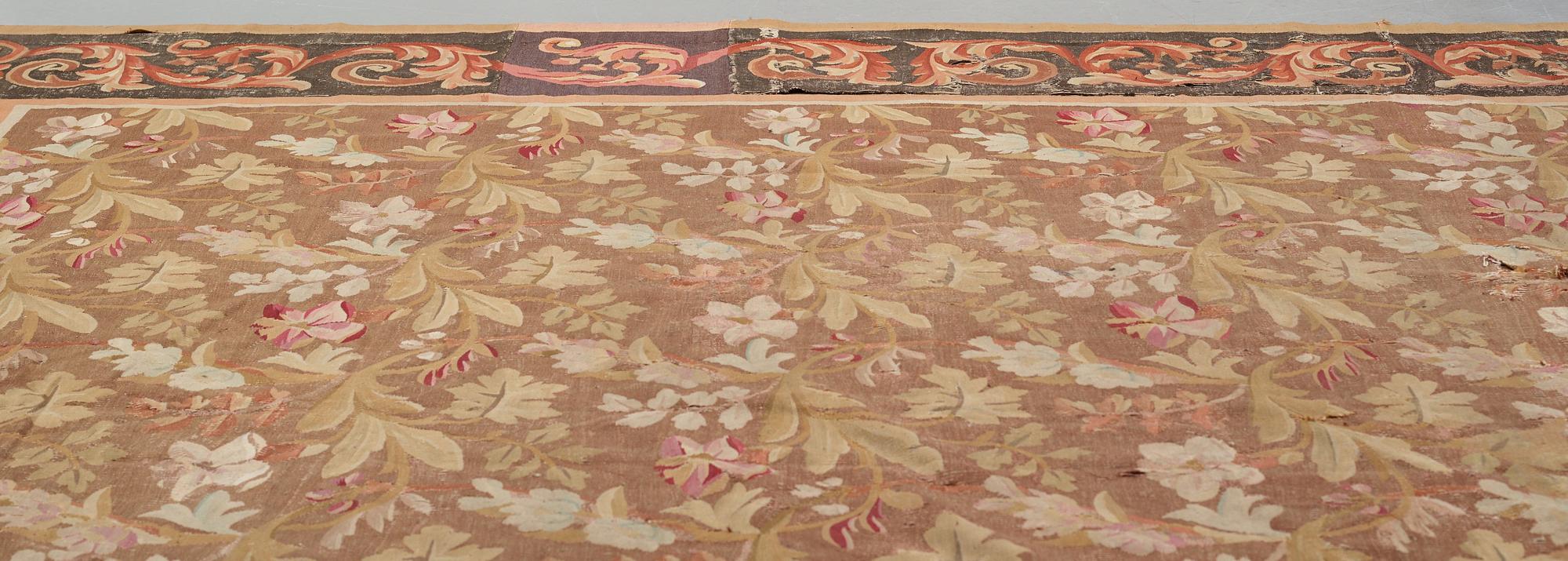A CARPET, tapestry weave, ca 415,5-419 x 392-396 cm, Aubusson, France, the age of Louis Philippe, around 1840.