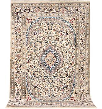 A Nain carpet, part silk, 9 laa, c. 300 x 195 cm.