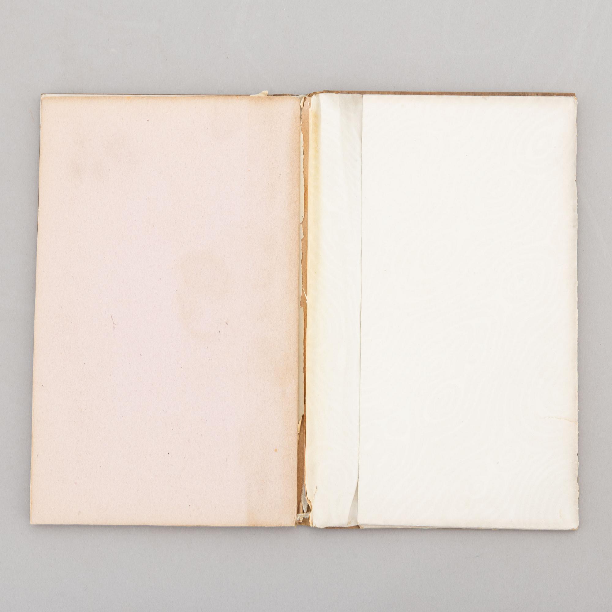 A keepsake book embellished by Ellen Jolin featuring a 'Santa Claus' figure.