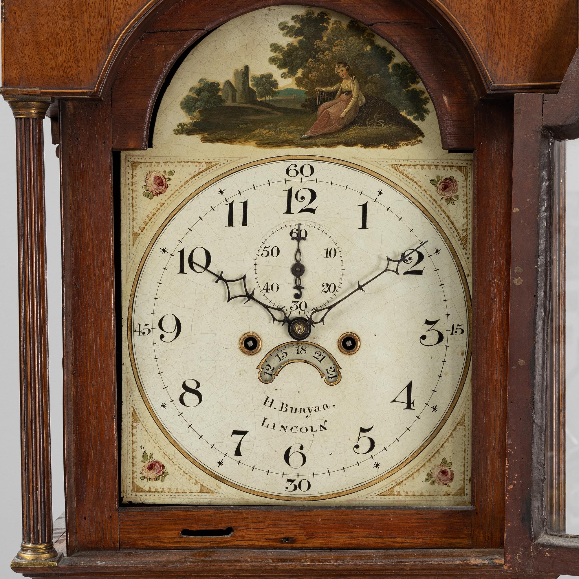 A mahognay long case clock from around the year 1800, H Bunyan Lincoln.