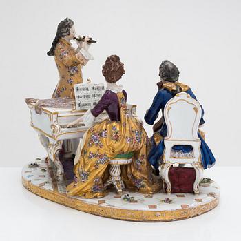 A Volkstedt porcelain musical trio figurine, mid-20th century. Length 40 cm.