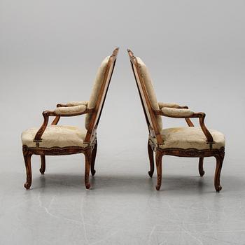 A pair of Louis XV style armchairs from early 20th Century.