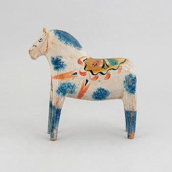 A wooden carved and painted 'Dalahäst', early or mid 20th century.