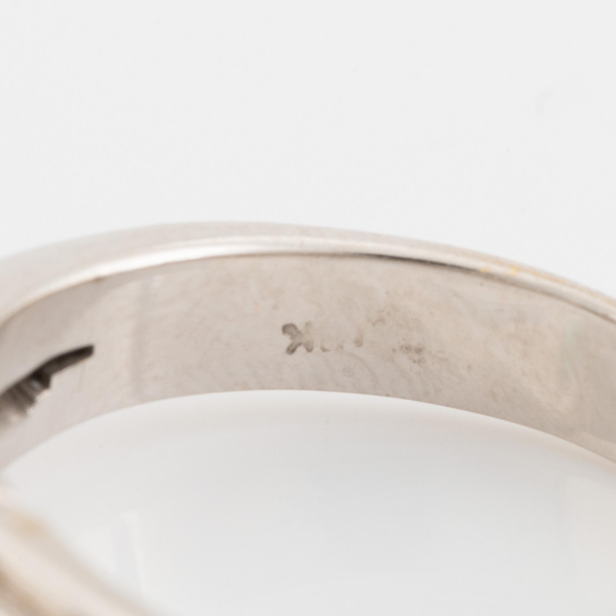 Emeralt cut emerald and brilliant cut diamond ring.