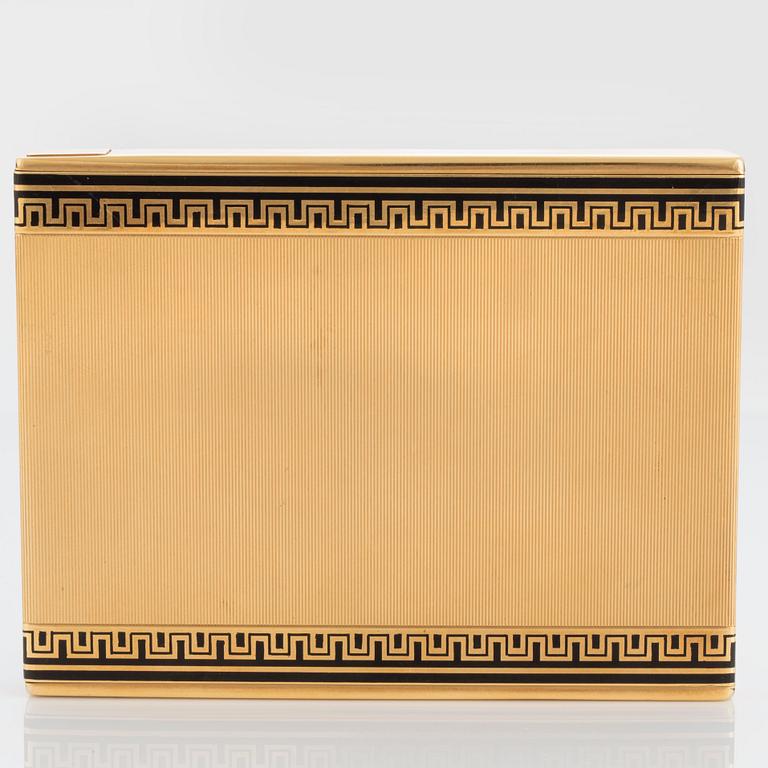 A Cartier cigarette case in 18K gold with black enamel.