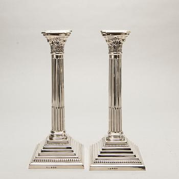 A pair of classical column sterling silver candlesticks Birmingham, 1934, by 'B.G. & Co'.